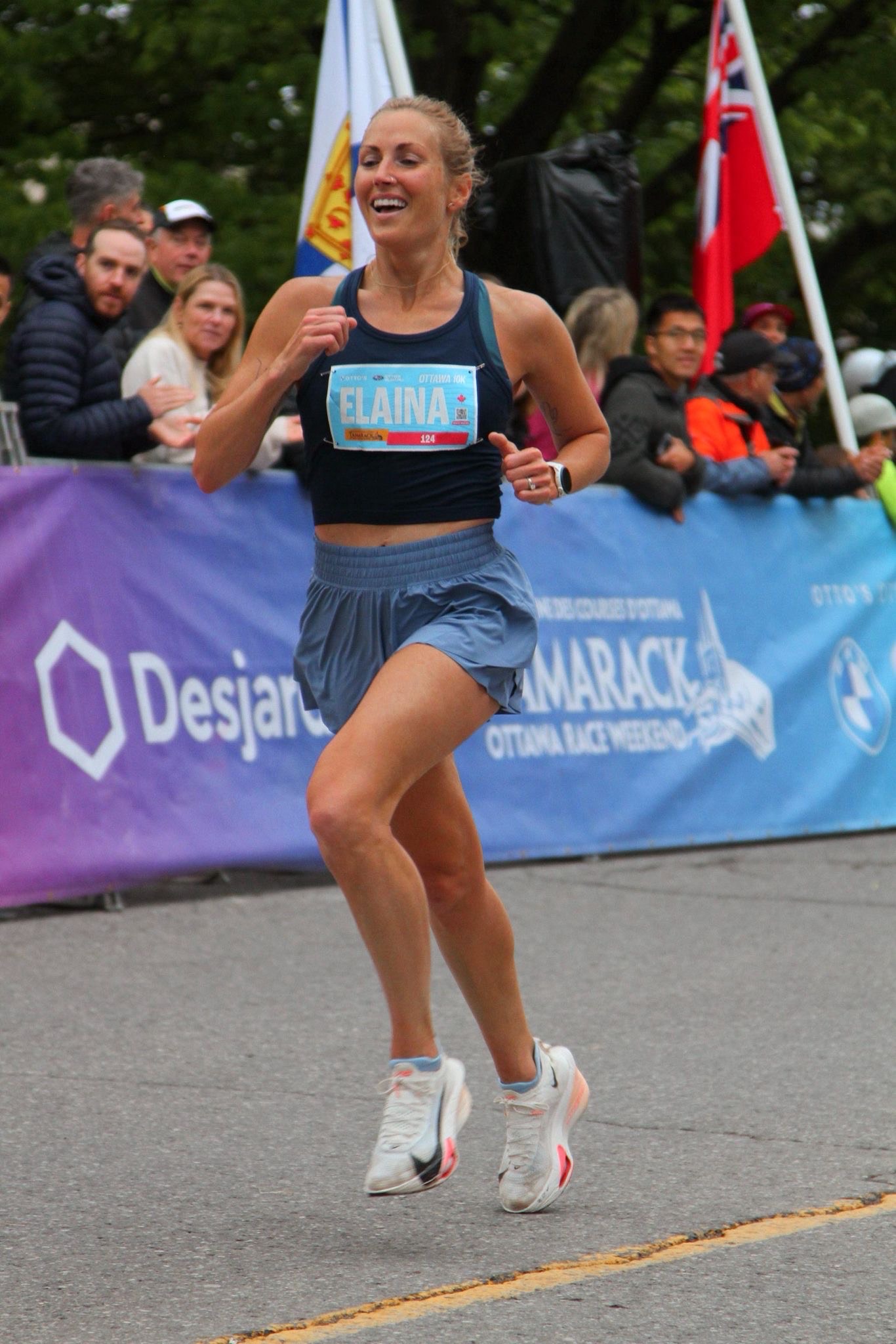 Elite runner and TRR Coach Elaina Raponi racing the Ottawa 10K.