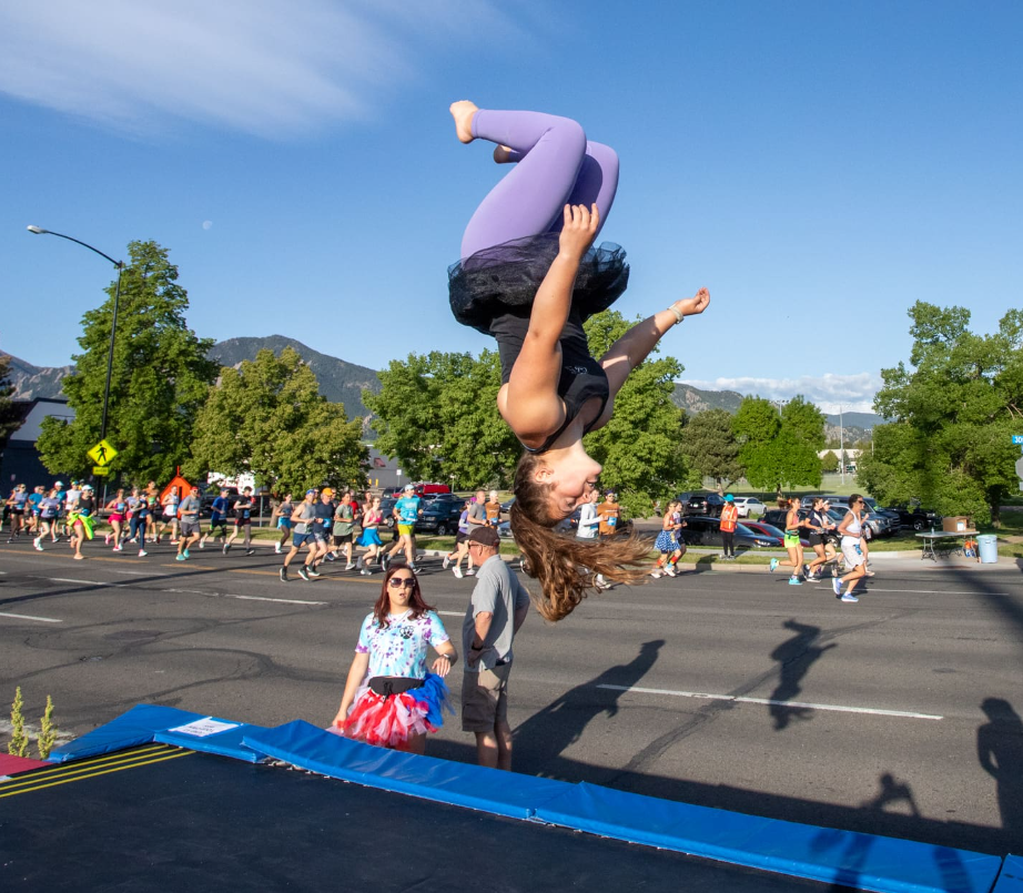 A runner bouncing on a trampoline during the BOLDERBoulder 10K!