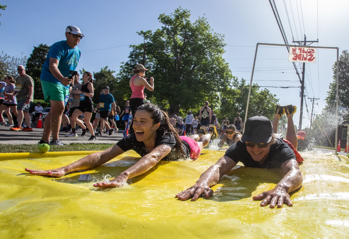 Runners taking a mid-race slip n' slide!