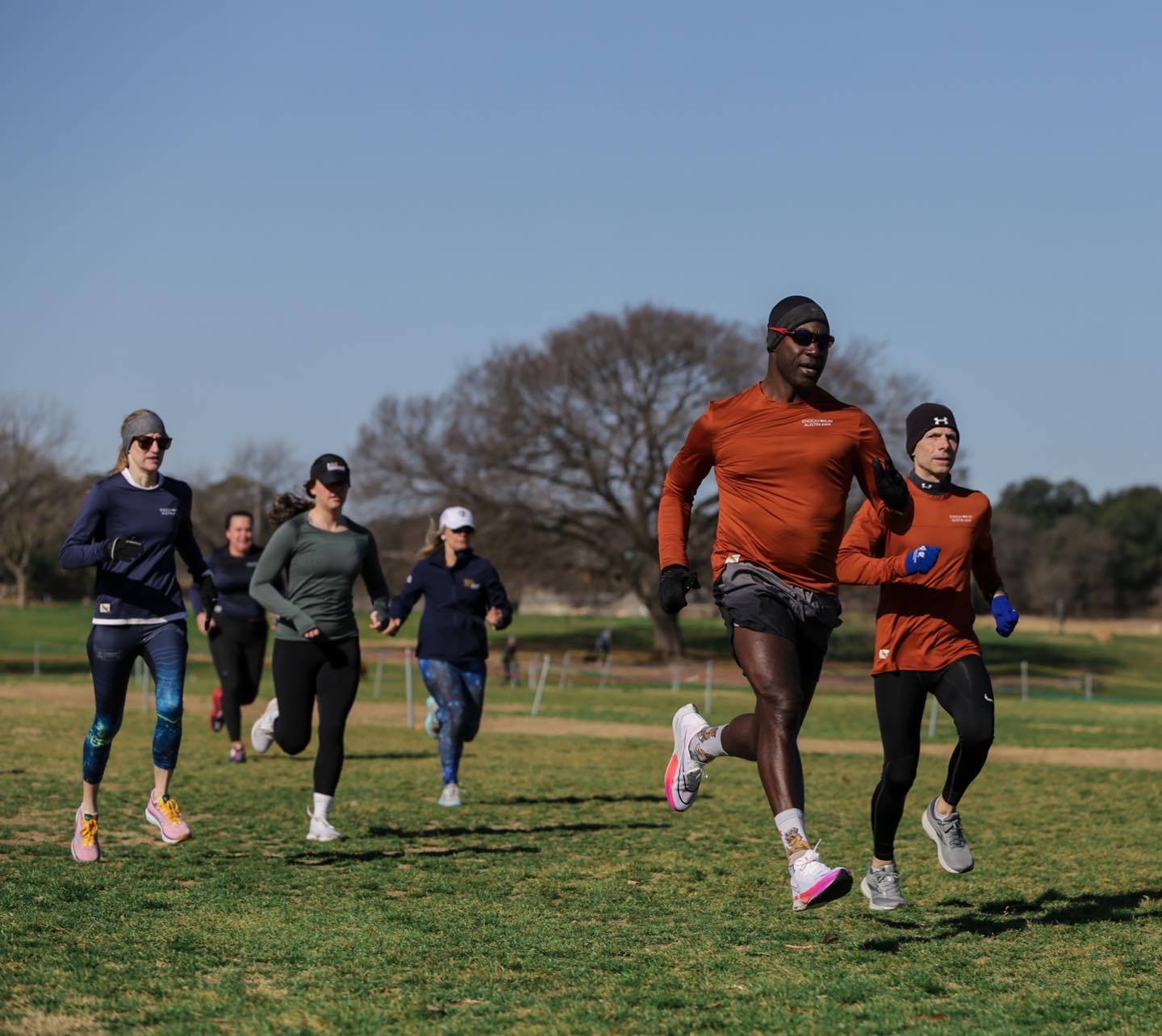 A running group training together in winter.